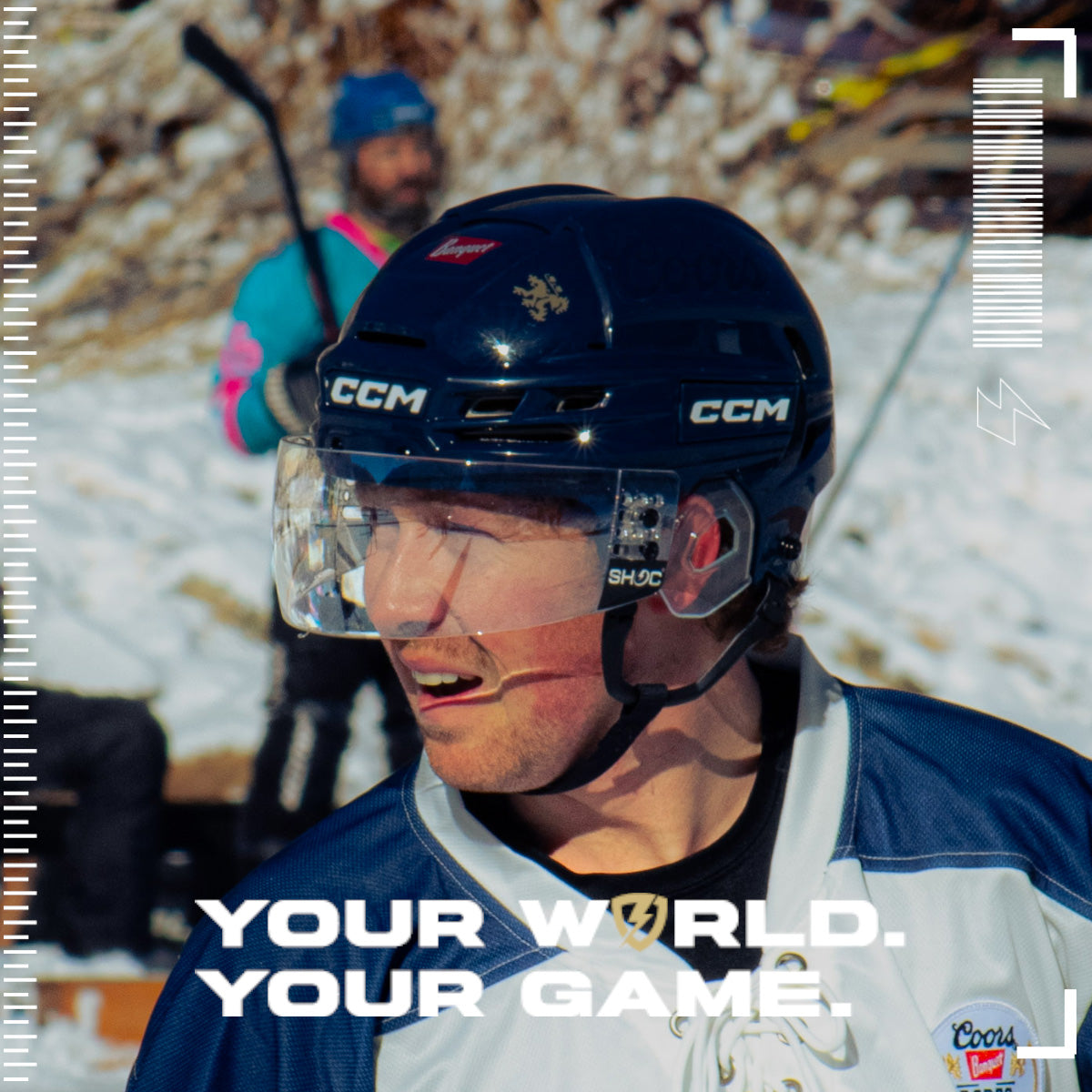 Person wearing a hockey helmet with a Clear SHOC Hockey Visor on a Snowy background