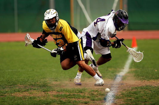 how long is a lacrosse game - Photo by Pixabay: https://www.pexels.com/photo/man-wearing-yellow-and-black-sport-jersey-holding-lacrosse-stick-159573/